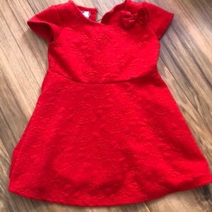 Red dress has flower pattern